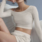 Asymmetric Sheer Glow Long‑Sleeve — Ivory