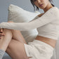 Asymmetric Sheer Glow Long‑Sleeve — Ivory